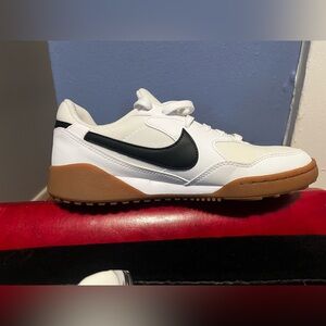 New without box. Nike White Low-Top Sneakers with Black Swoosh and Gum Sole